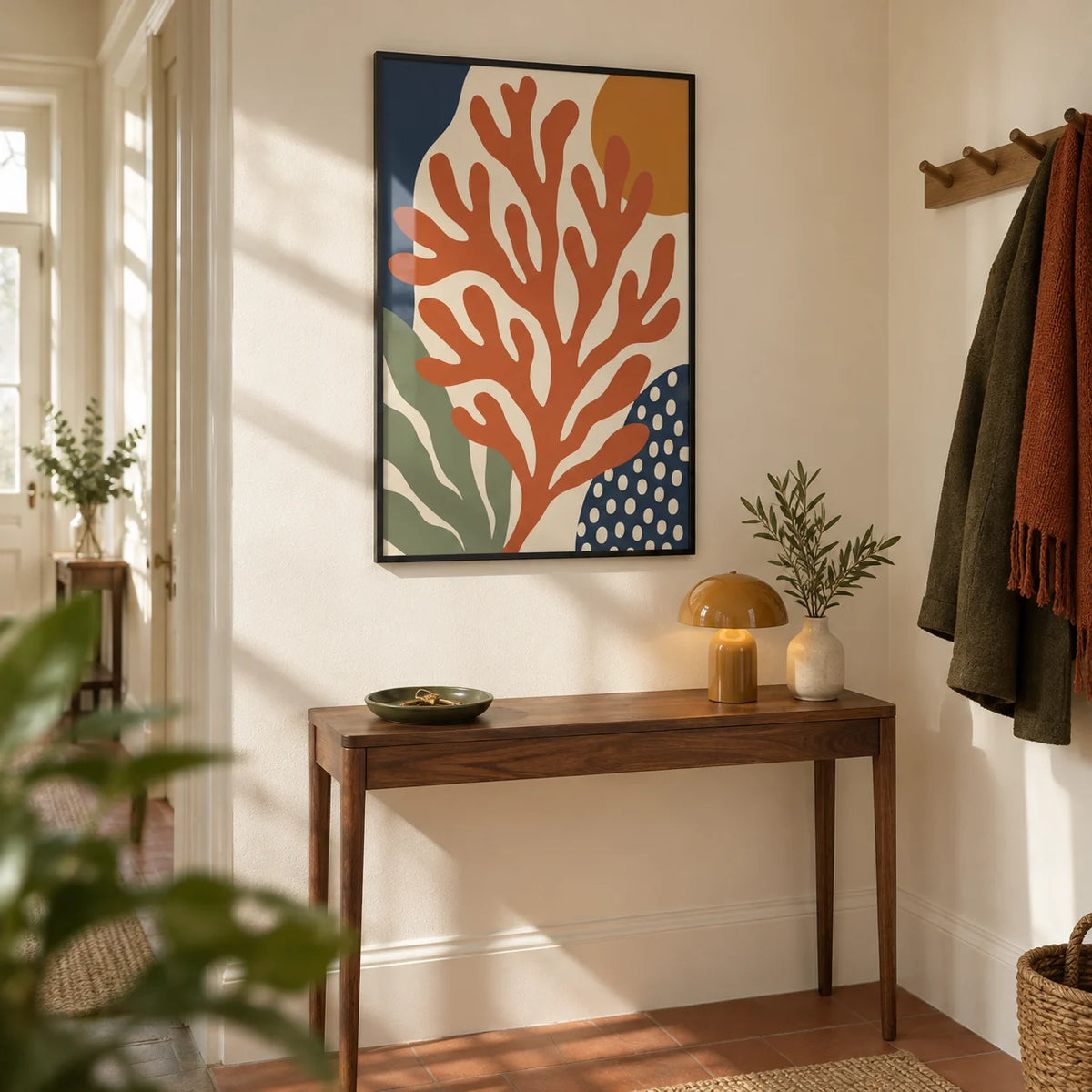 Coral Wall Art, framed on the wall of a welcoming hallway in a renovated UK terrace with pale cream walls and a plain terracotta floor