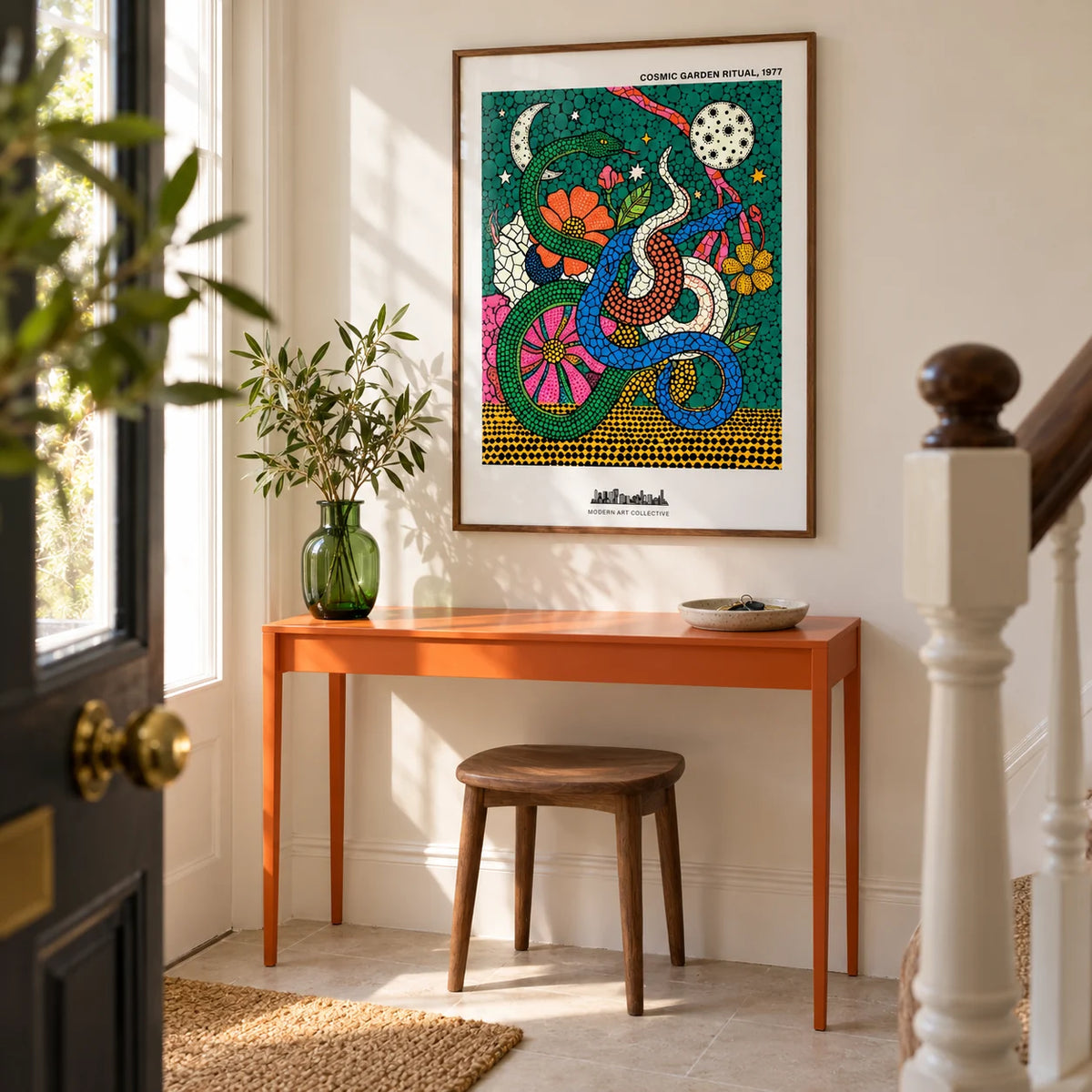 Cosmic Garden Print, framed on the wall of a bright entrance hallway in a UK terrace with warm white walls and a plain pale stone floor