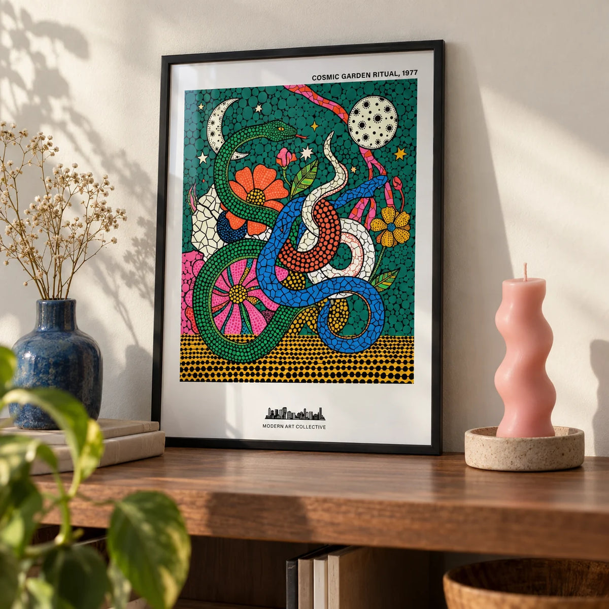 Cosmic Garden Print, a small A4 framed print leaning on a walnut shelf in a living room