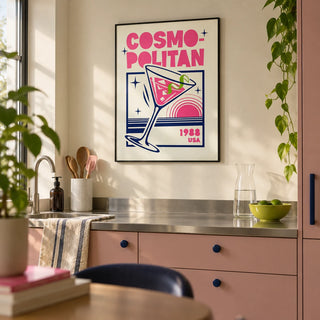 Cosmopolitan Cocktail Art Print, framed on the wall of a modern kitchen in a first flat (22-28) with plain muted pink cabinets