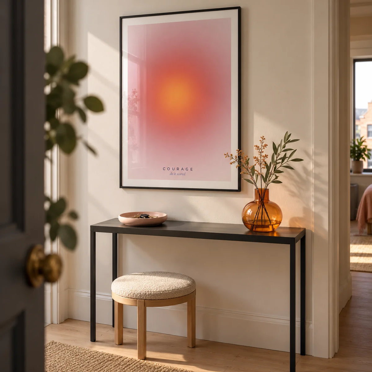 Courage Poster, framed on the wall of a compact modern hallway in a UK city flat with a warm white wall and pale timber flooring