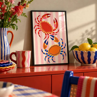 Crab Print, a small A4 framed print leaning on a colourful lacquered shelf in a living room