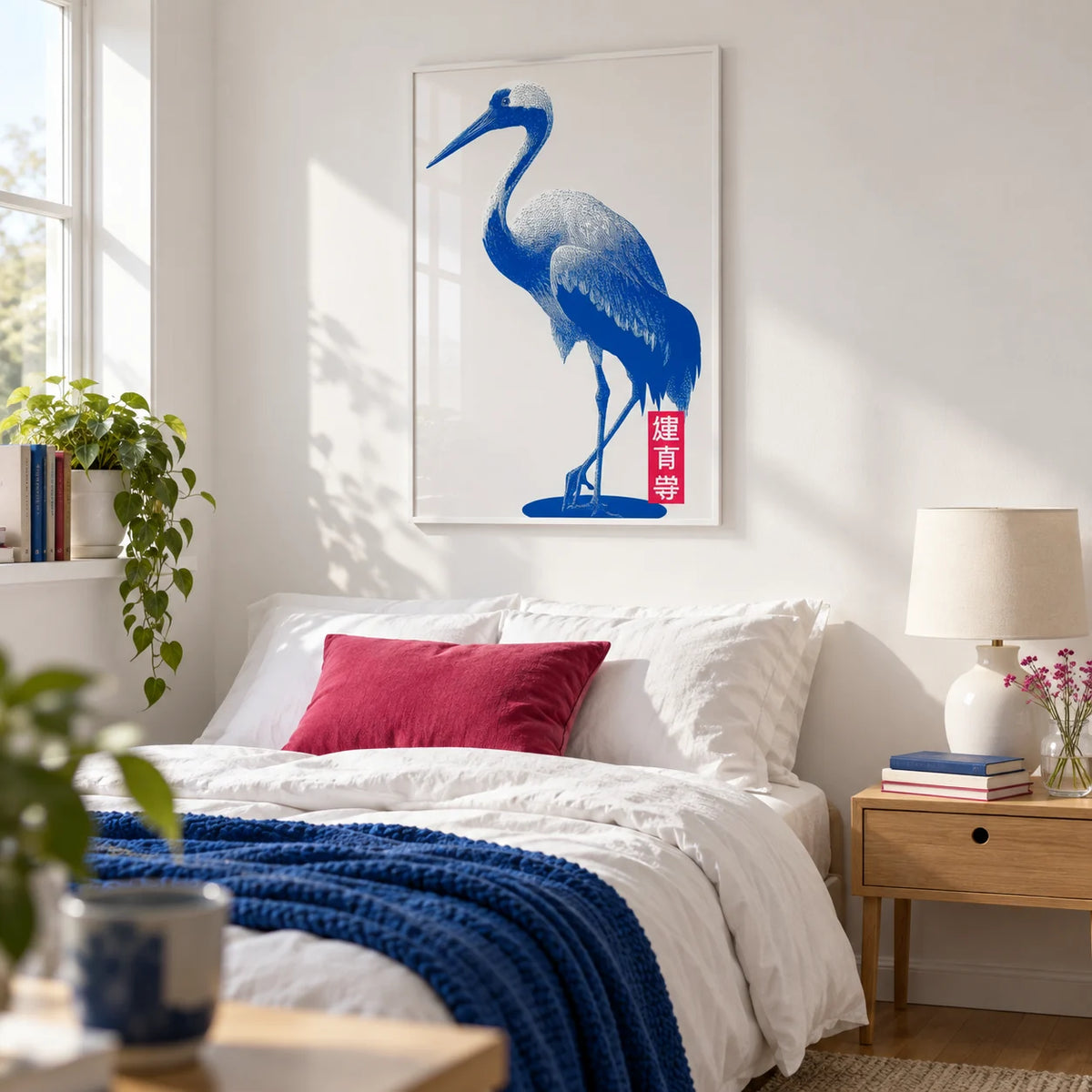 Crane Wall Art, framed on the wall of a fresh young woman's bedroom (18-26) with a white wall