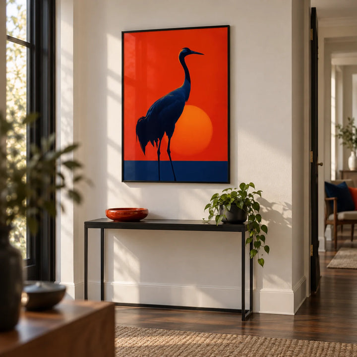 Cranes Silhouette Art Print, framed on the wall of a modern hallway with a white wall and a dark wood floor