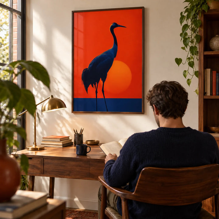 Cranes Silhouette Art Print, framed on the wall of a quiet study with a warm white wall