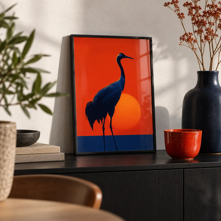 Cranes Silhouette Art Print, a small A4 framed print leaning on a black sideboard in a living room