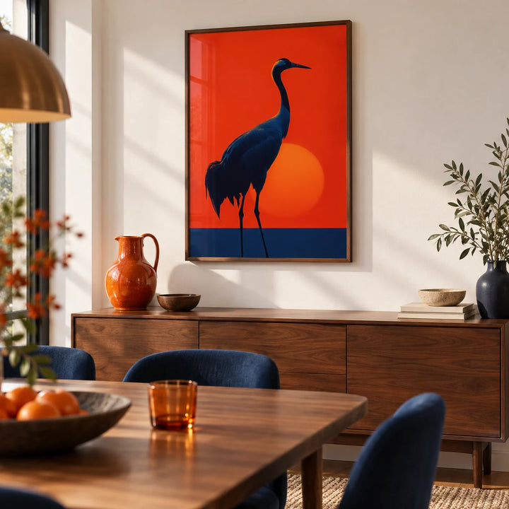 Cranes Silhouette Art Print, framed on the wall of a warm modern dining room with a white wall