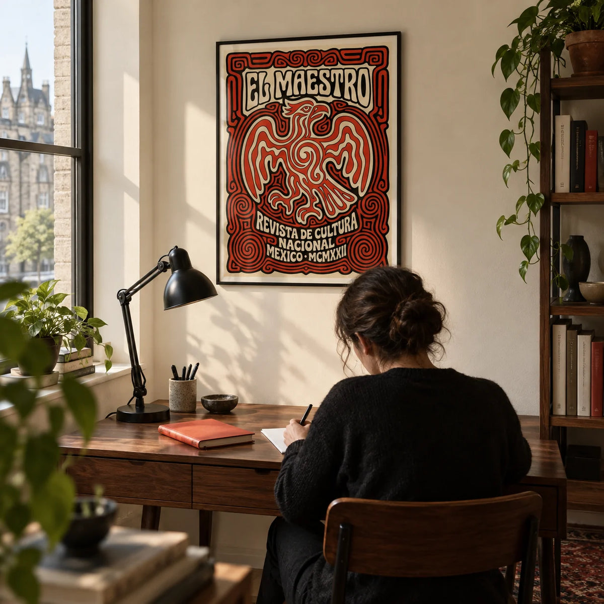Cultural Mexican Poster, framed on the wall of a compact design-led home study in a UK city flat with a pale cream wall and dark timber floor