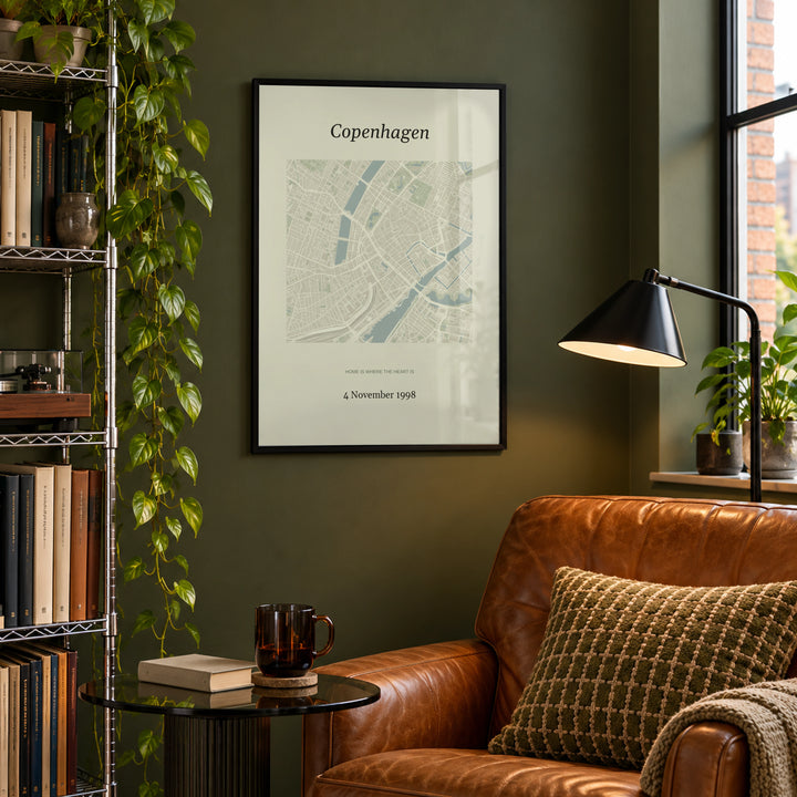 Anniversary Map Print in a city-apartment reading corner, black frame