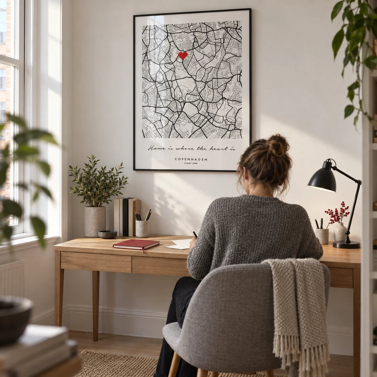 Custom Anniversary Gift, framed on the wall of a compact home study in a couple's UK flat with a white wall and pale oak floor