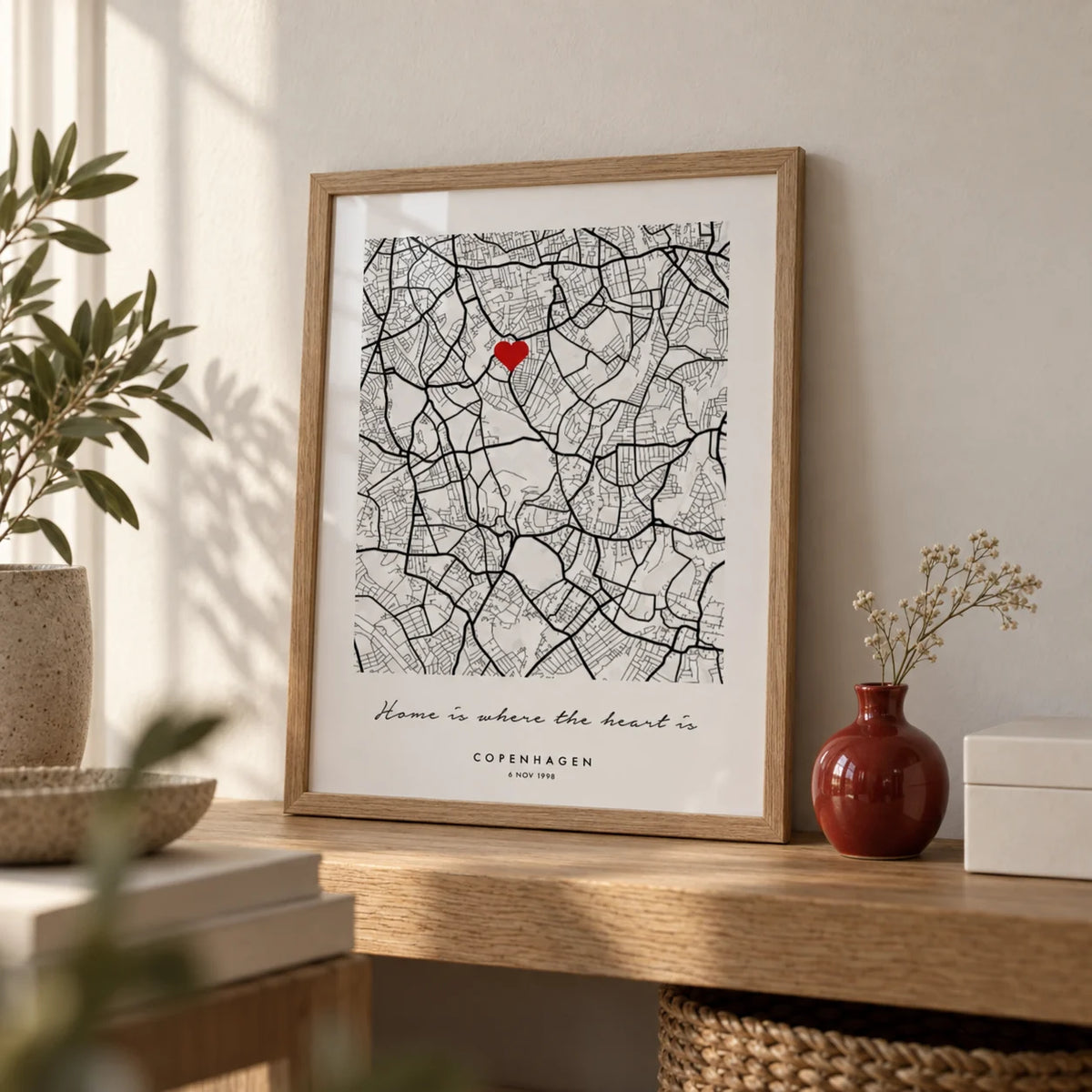 Custom Anniversary Gift, a small A4 framed print leaning on an oak shelf in a living room