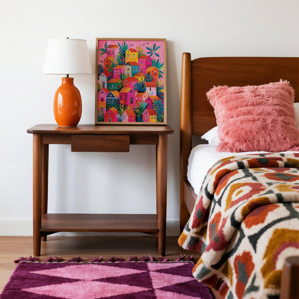 Bright poster print of a Mexican village with tropical details.