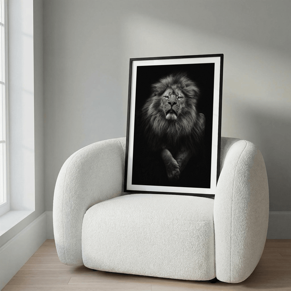 Centered black and white lion poster showing intense gaze and textured fur