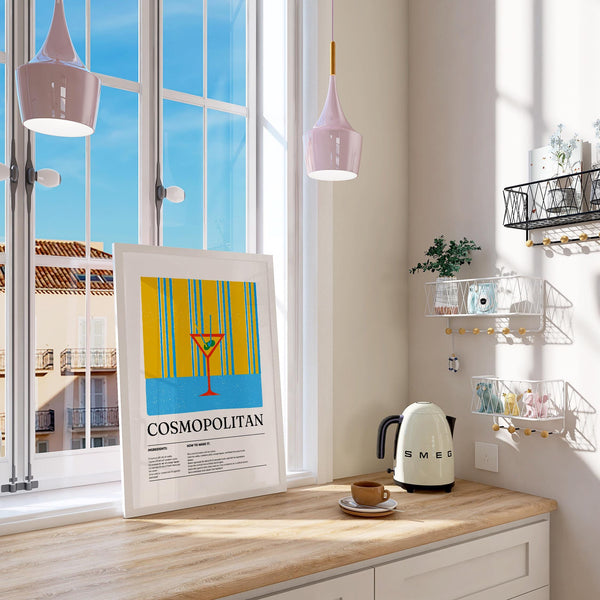 Modern kitchen wall art with a Cosmopolitan cocktail on yellow and blue.