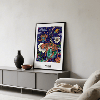 Graphic animal wall art featuring a leopard resting on a globe-like planet amid stars