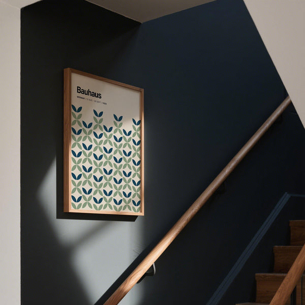 A flat graphic print of blue and green wall art inspired by early 20th-century design.