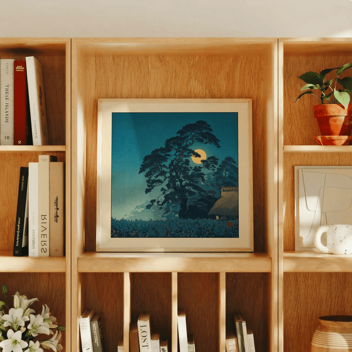 Blue-toned pine silhouette and layered hills under full moon