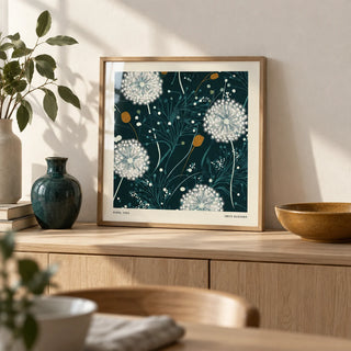 Dandelion Wall Art, a small A4 framed print leaning on a pale oak sideboard in a living room