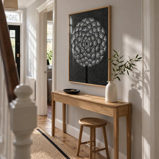 Dandelion Wall Print, framed on the wall of a bright narrow hallway in a UK terraced house with a pale grey wall and oak floorboards