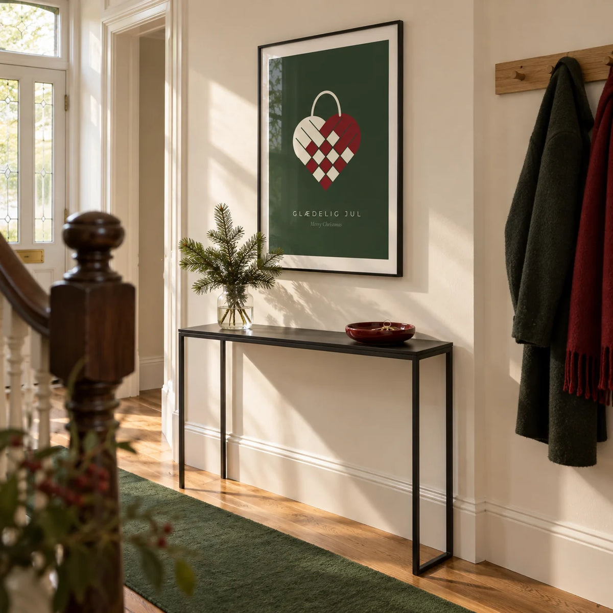 Danish Christmas Print, framed on the wall of a bright entrance hallway in a Victorian terrace with warm white walls and an oak floor