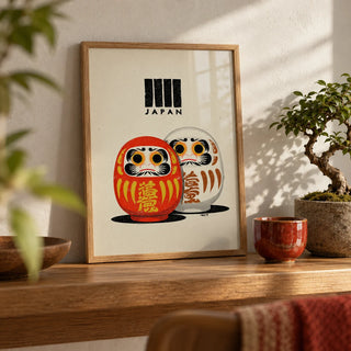 Daruma Print, a small A4 framed print leaning on an oak shelf in a living room