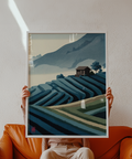 Minimalist landscape wall art of curved rice terraces, tree silhouette, and cabin