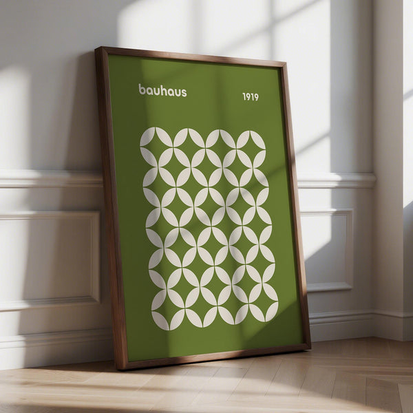 Mid century geometric Bauhaus wall art in olive green with cream circular shapes.