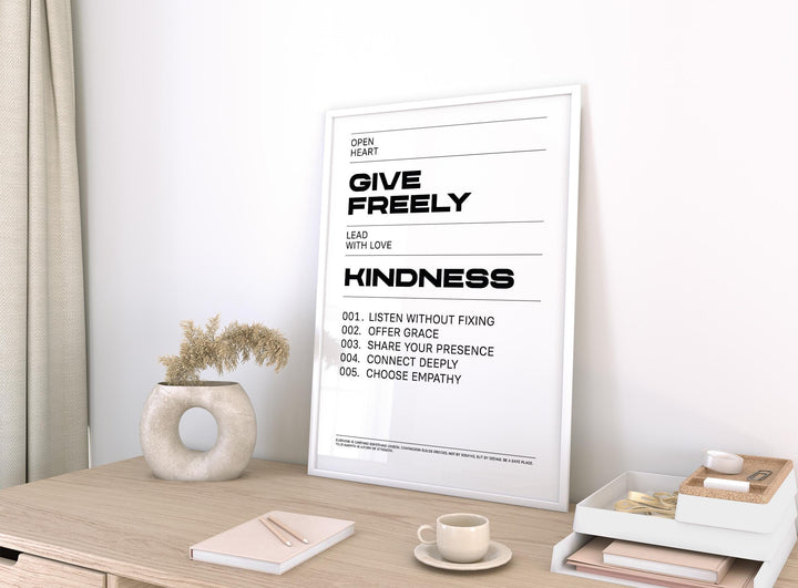 Art with Quotes leaning on a desk with neutral colours and a round vase in a bright room