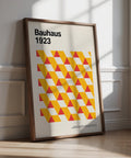 Art posters gallery print with yellow and red Bauhaus triangles on cream background.