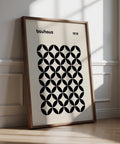 Black geometric mid century wall print with retro Bauhaus pattern on beige background.