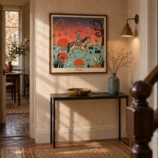 Death Tarot Card Art, framed on the wall of a welcoming narrow hallway in a period maisonette with pale clay plaster walls and original timber flooring