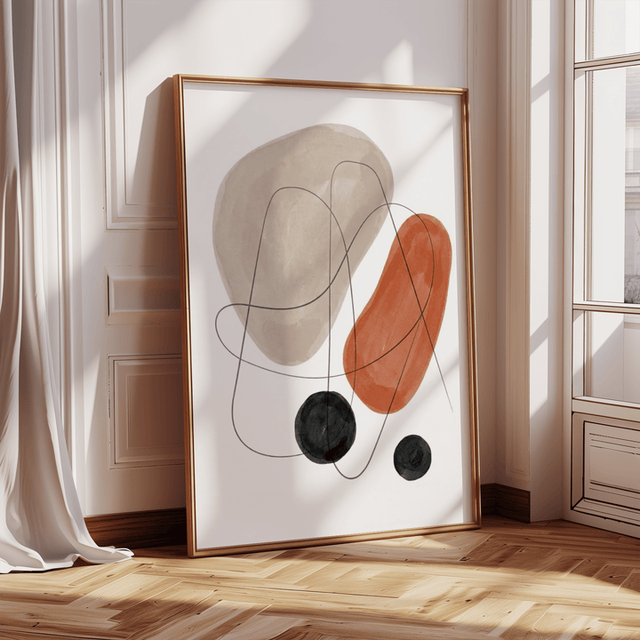 Abstract Shapes Art Print leaning with gold frame with sunlight on parquet floor