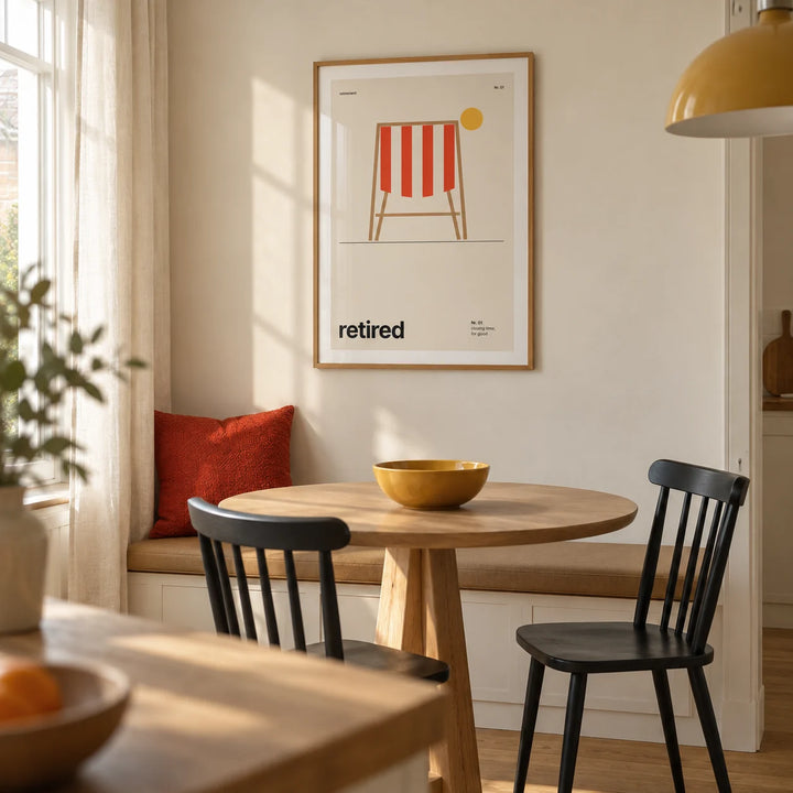 Deckchair Print, framed on the wall of a modern dining nook in a UK terraced house with a cream wall and simple oak furniture