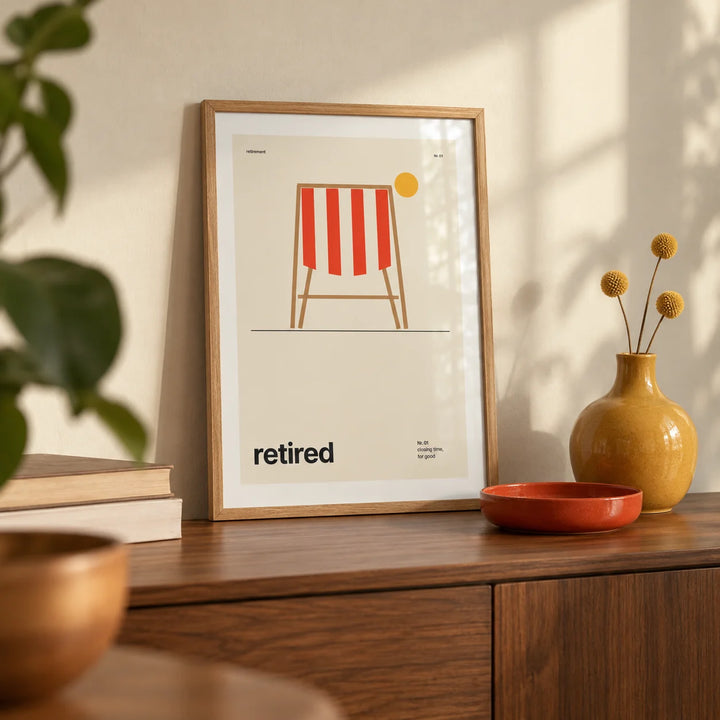 Deckchair Print, a small A4 framed print leaning on a walnut sideboard in a living room