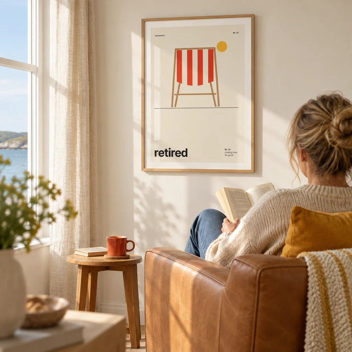 Deckchair Print, framed on the wall of a sunny reading corner in a modern UK coastal home with a pale cream wall in a living room