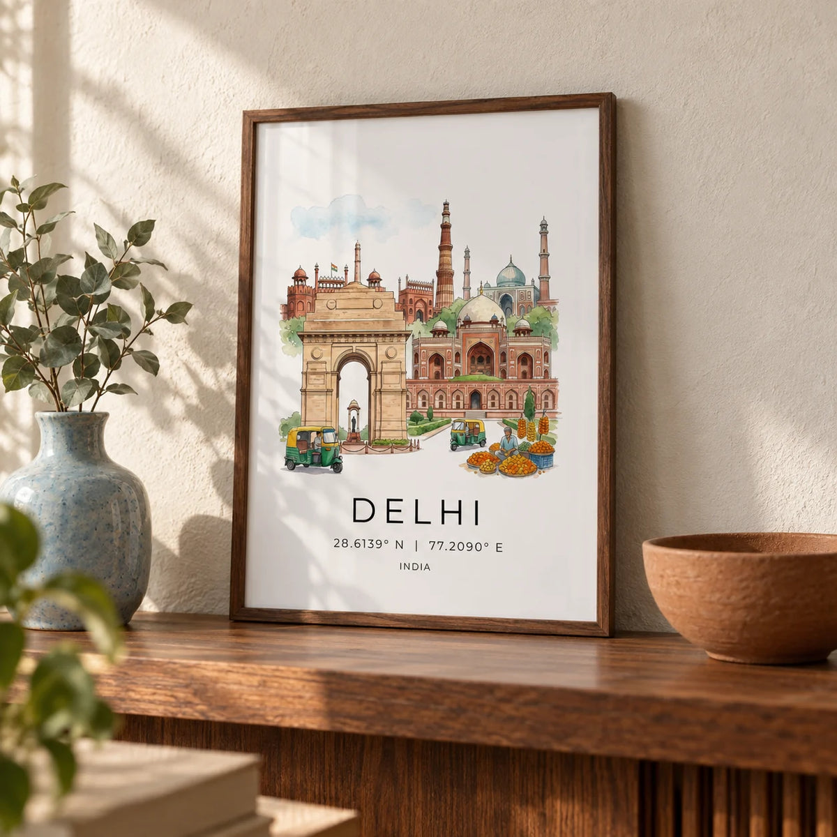 Delhi Landmark Art Print, a small A4 framed print leaning on a walnut shelf in a living room