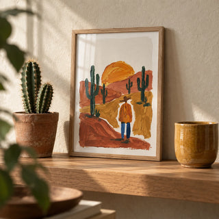 Desert Landscape Art Print, a small A4 framed print leaning on an oak shelf in a living room