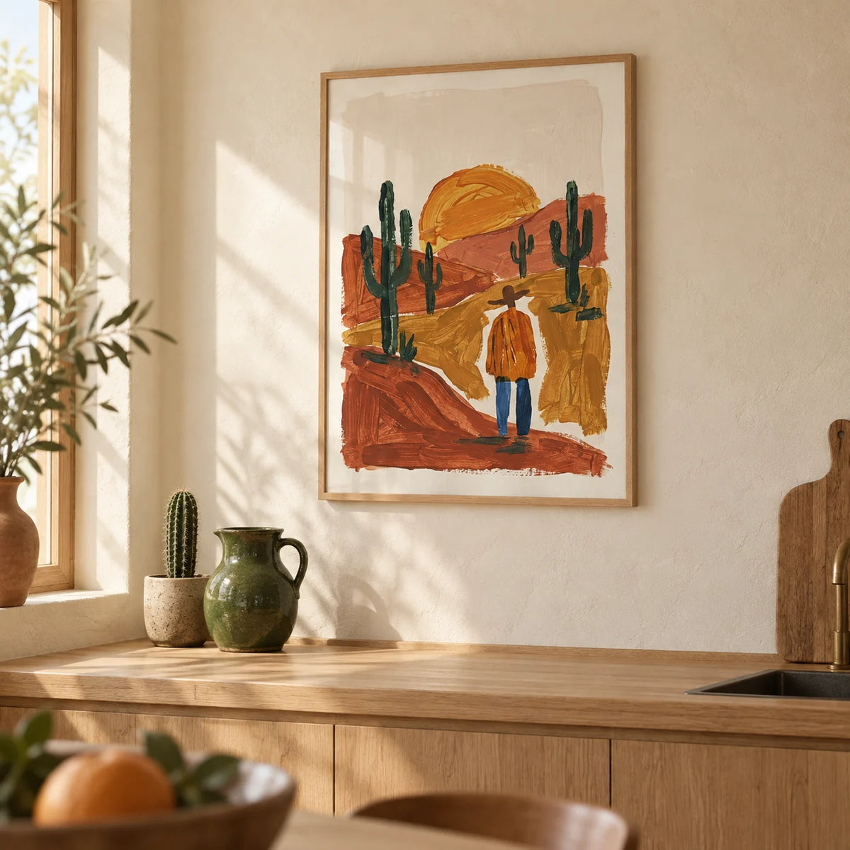 Desert Landscape Art Print, framed on the wall of a warm plaster kitchen with cream walls