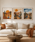 Living room with a white sofa, wooden coffee table, and desert-themed wall art.