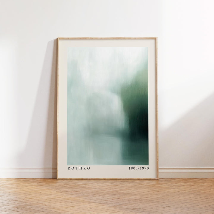 Print leaning on a wooden floor wall art abstract in blue and green soft tones