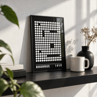 Digital Wall Art, a small A4 framed print leaning on a black shelf in a living room
