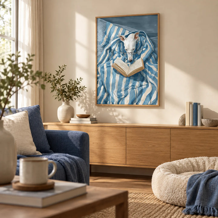 Dog Reading Print, framed on the wall of a cosy living room with a warm cream wall
