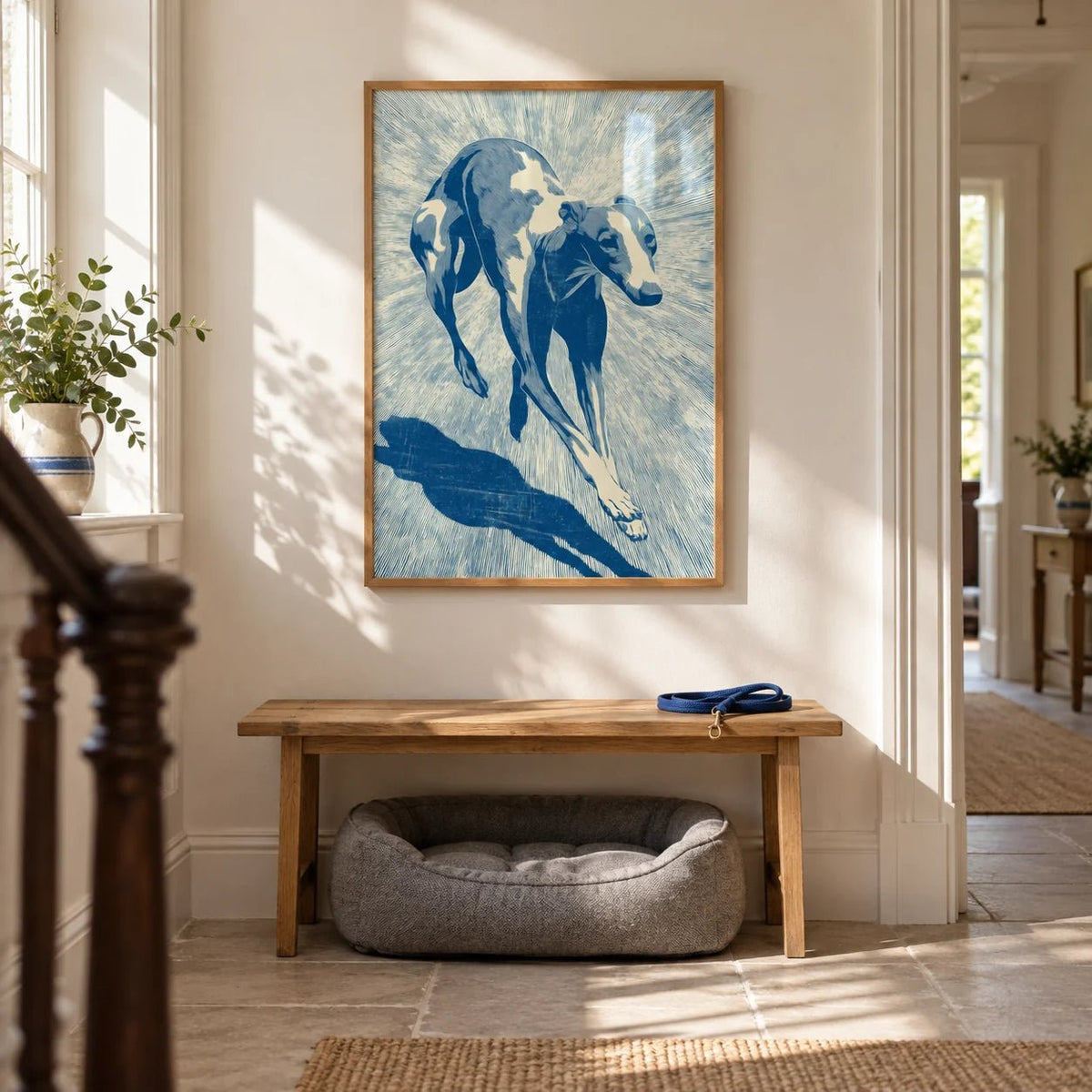 Dog Wall Art, framed on the wall of a bright Victorian hallway with a cream wall and a plain stone floor