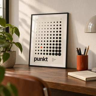 Dots Print, a small A4 framed print leaning on a walnut desk