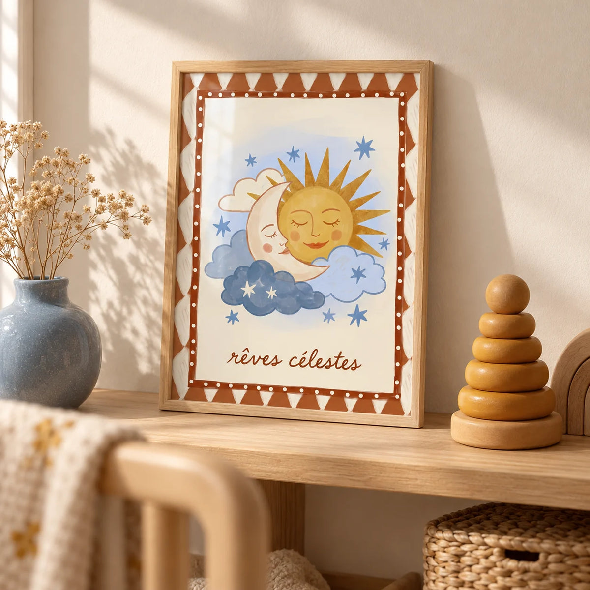 Moon And Sun Print, a small A4 framed print leaning on a pale oak nursery shelf