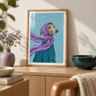 Dressed Up Dog Art, a small A4 framed print leaning on a pale oak sideboard in a living room