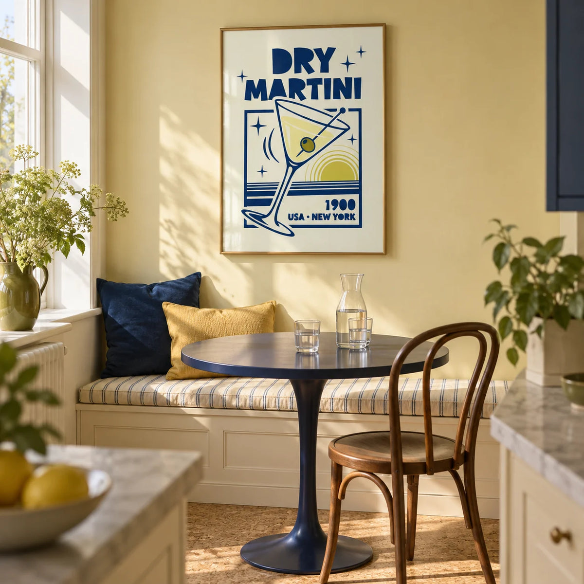 Dry Martini Poster, framed on the wall of a compact kitchen breakfast nook in a renovated UK maisonette with a pale yellow wall and a built-in cream bench