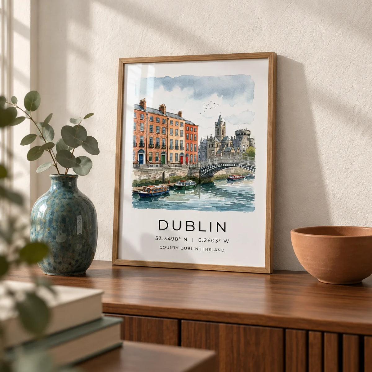 Dublin City Art Print, a small A4 framed print leaning on a walnut sideboard in a living room