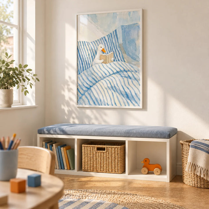 Duck Reading Art Print, framed on the wall of a light-filled playroom with warm white walls and a cork floor in a UK family home
