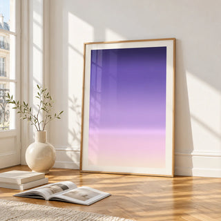Dusk Wall Art, framed and leaning on the parquet floor of a bright living room